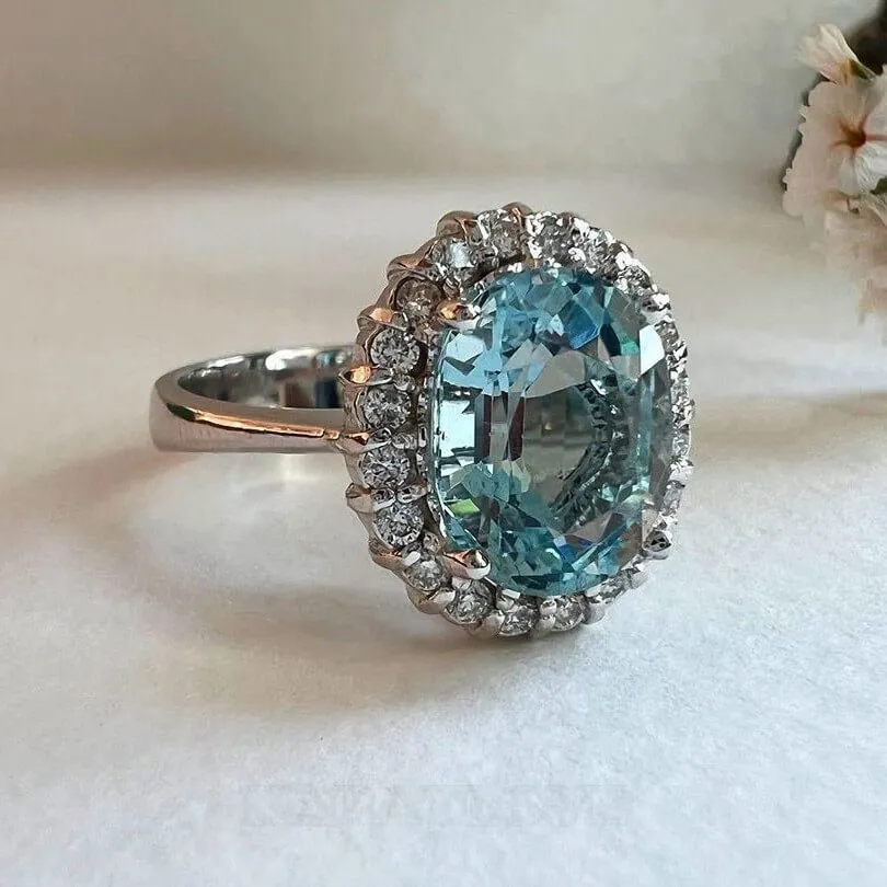 Oval Cut Aquamarine Sterling Silver Halo Engagement Ring