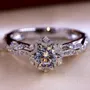 Round Cut Diamond White Art Deco Halo Engagement Ring in 925 Sterling Silver