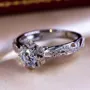 Round Cut Diamond White Art Deco Halo Engagement Ring in 925 Sterling Silver