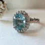 Oval Cut Aquamarine Sterling Silver Halo Engagement Ring