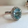 Oval Cut Aquamarine Sterling Silver Halo Engagement Ring