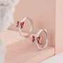 Round Cut Diamond White Sterling Silver Hoop Earrings with Red Bow