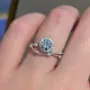 Round Cut Diamond White Halo Art Deco Engagement Ring in Sterling Silver
